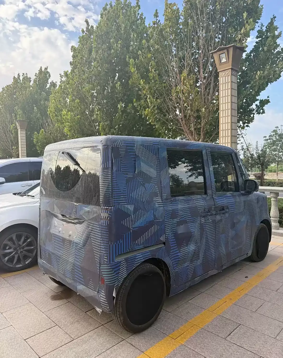 比亚迪全新纯电 K-Car 首张预告图发布,2025 东京车展首发